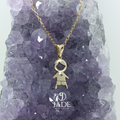 Collar con dije de niño con piedra