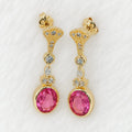 Aretes largos con piedra rosada