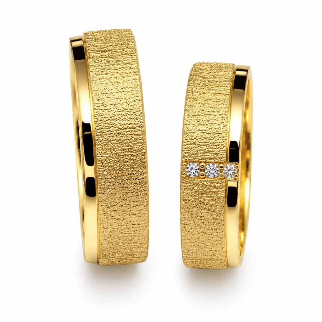 Aros de matrimonio gaspeados con piedras en oro de 18k