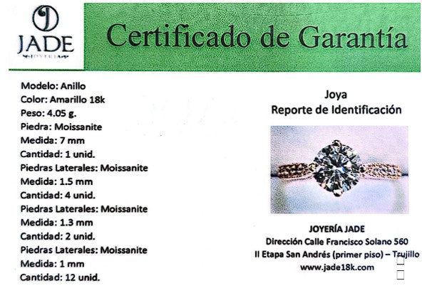 Jade18k 18k yellow gold engagement ring with a large moissanite center stone and smaller moissanite accents on the band.