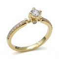 Jade18k 18k yellow gold engagement ring with a central moissanite stone and pavé-set stones along the band.