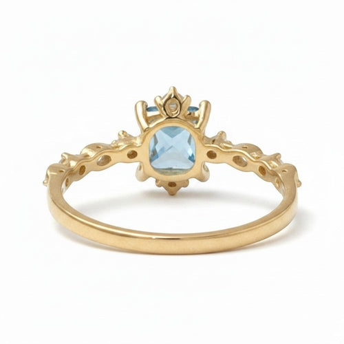 Jade18k yellow gold ring with a square-cut blue gemstone and accent stones on a detailed band.