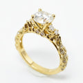 Jade18k Camila engagement ring in 18k orange gold with a central cubic zirconia and intricate detailing on the band.