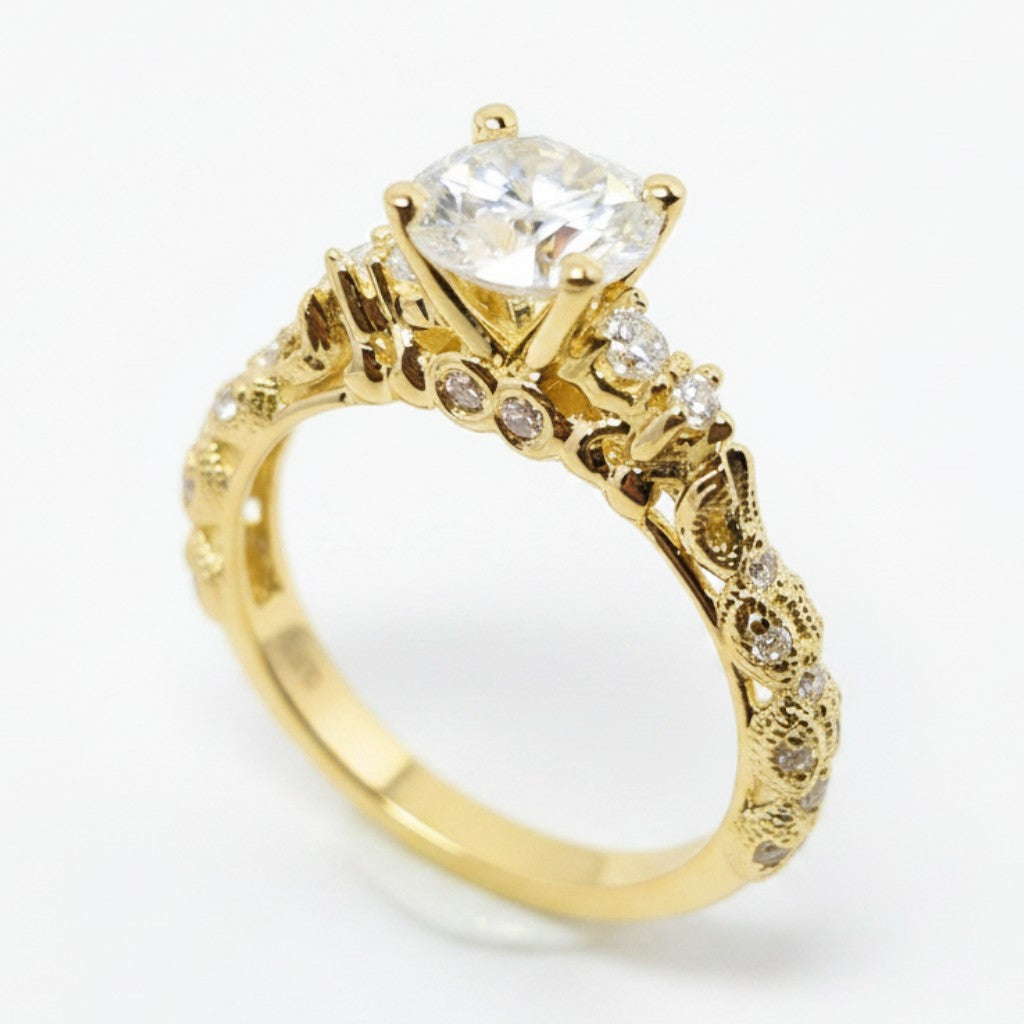 Jade18k Camila engagement ring in 18k orange gold with a central cubic zirconia and intricate detailing on the band.