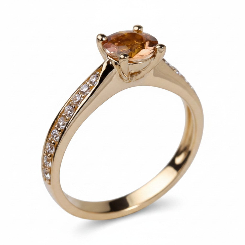 Jade18k Camille engagement ring in 18k orange gold with a 5A cubic zirconia stone and diamond accents.