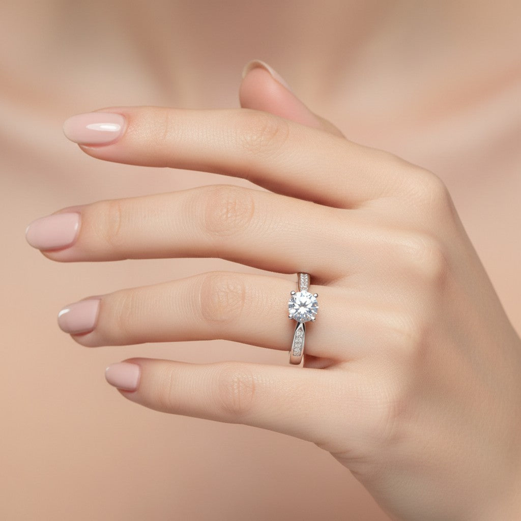 Jade18k Eugenia engagement ring in Sterling Silver 970 with a round-cut cubic zirconia and pavé-set stones on the band.
