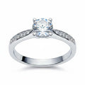 Jade18k Eugenia engagement ring in Sterling Silver 970 with a round-cut cubic zirconia and pave band.