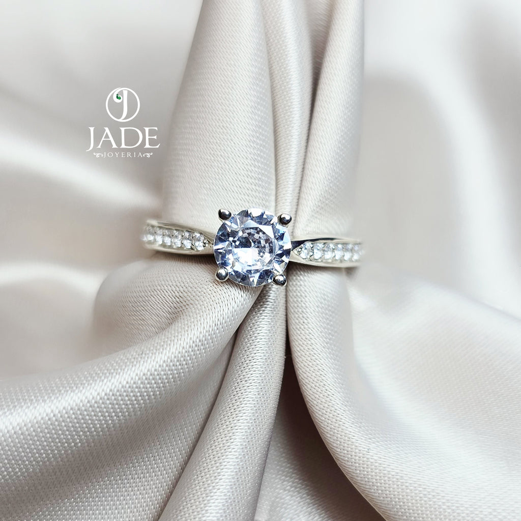 Jade18k Eugenia engagement ring in Sterling Silver 970 with a round-cut cubic zirconia and pavé band.