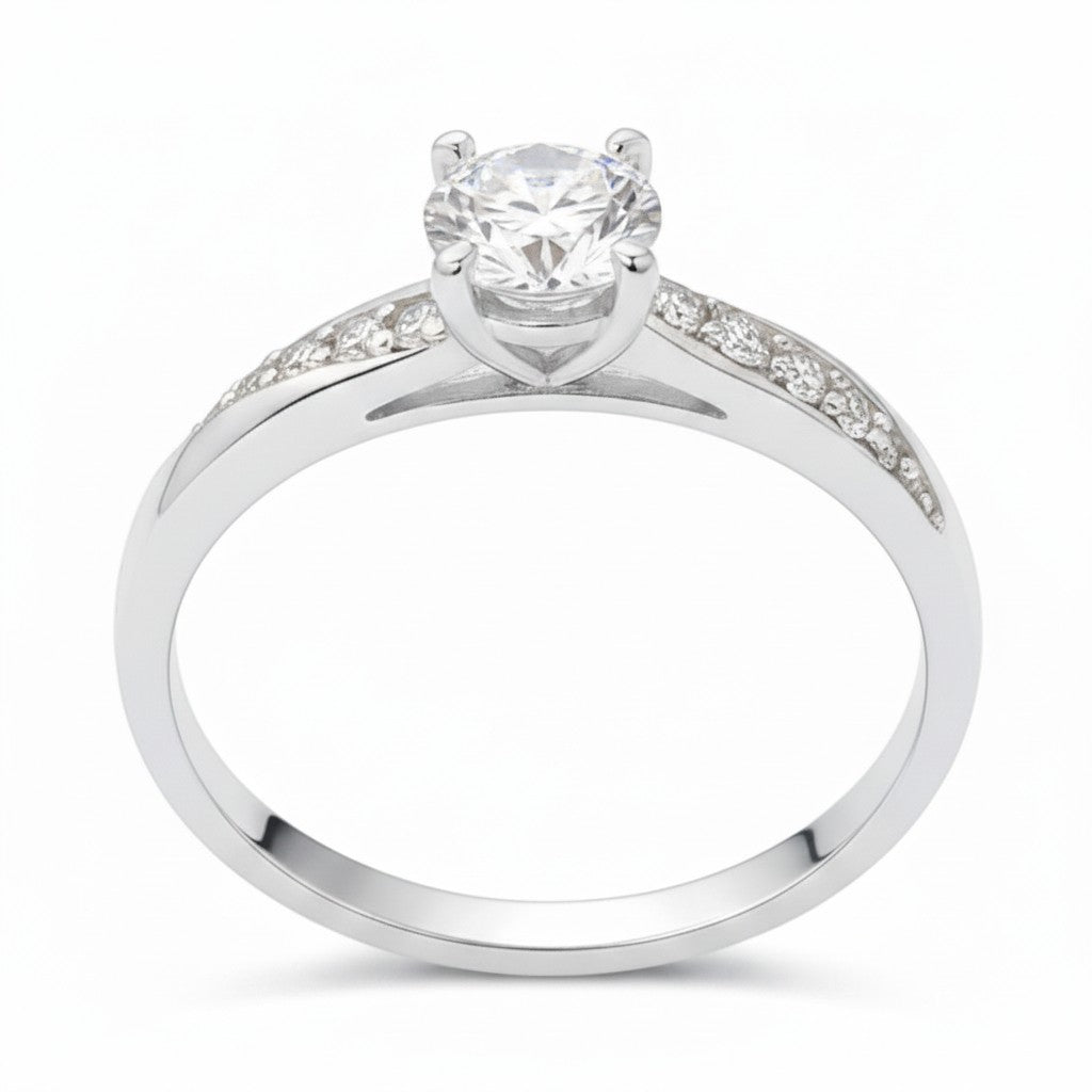 Jade18k April engagement ring in sterling silver with a round-cut diamond and pavé accents.