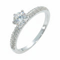 Jade18k engagement ring in sterling silver with a central round-cut diamond and pave-set stones on the band.