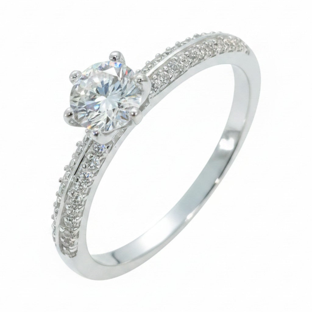 Jade18k engagement ring in sterling silver with a central round-cut diamond and pave-set stones on the band.