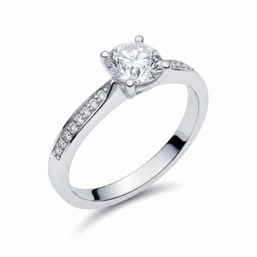 Jade18k Eugenia engagement ring in Sterling Silver 970 with a round-cut cubic zirconia and pavé-set stones on the band.