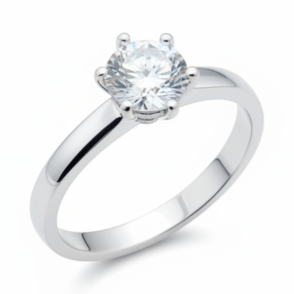 Jade18k Sueño de Amor ring in fine silver with a round-cut clear stone, six-prong setting.