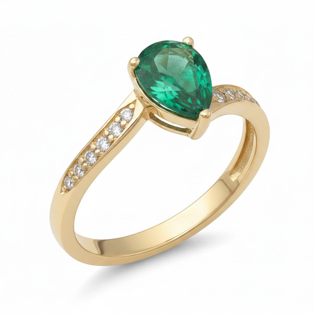 Jade18k yellow gold ring with a pear-cut green zircon center stone and moissanite side stones.