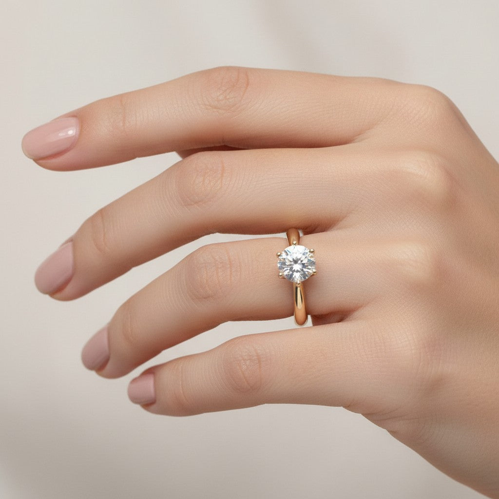 Jade18k Mi Reina engagement ring in 18k orange gold with a round cubic zirconia stone.
