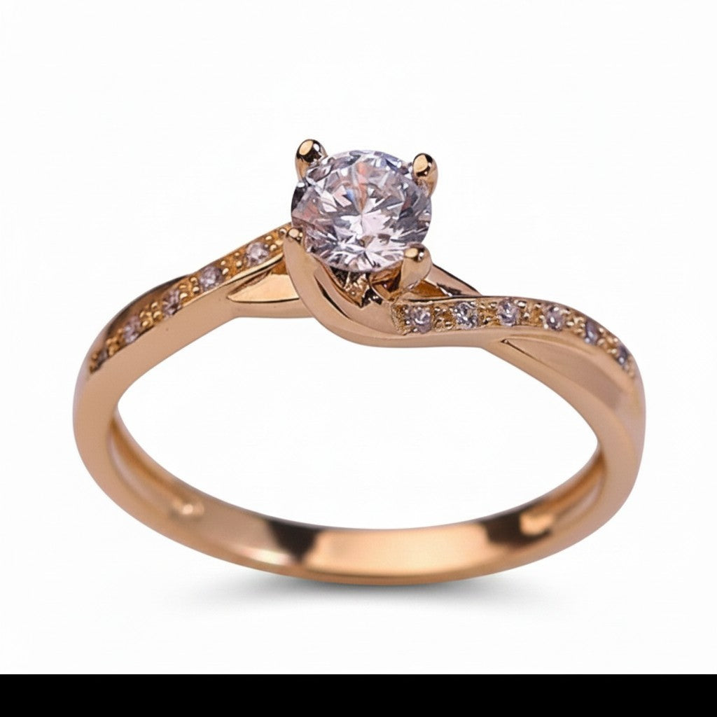 Jade18k Paulina engagement ring in 18k orange gold with a central clear stone and pave set stones on the band.