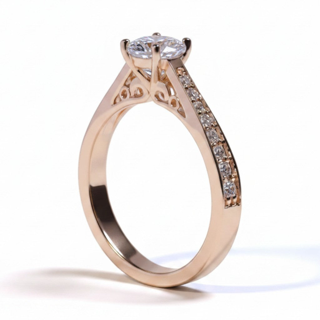 Jade18k Mariafer engagement ring in 18k orange gold with 5A cubic zirconia stones and intricate side detailing.