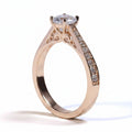 Jade18k Mariafer engagement ring in 18k orange gold with 5A cubic zirconia stones and intricate side detailing.
