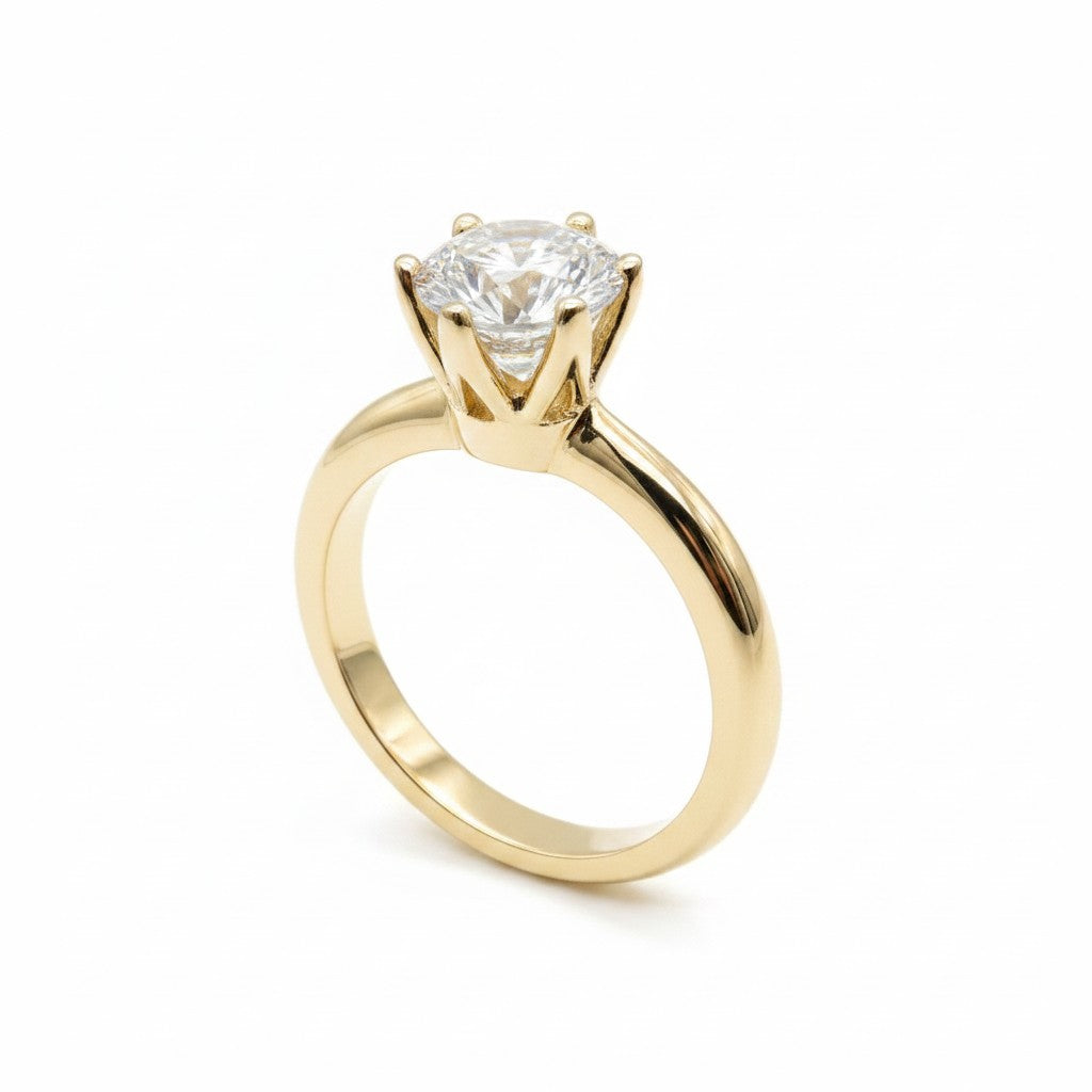 Jade18k Mi Reina engagement ring in 18k orange gold with a round cubic zirconia stone.
