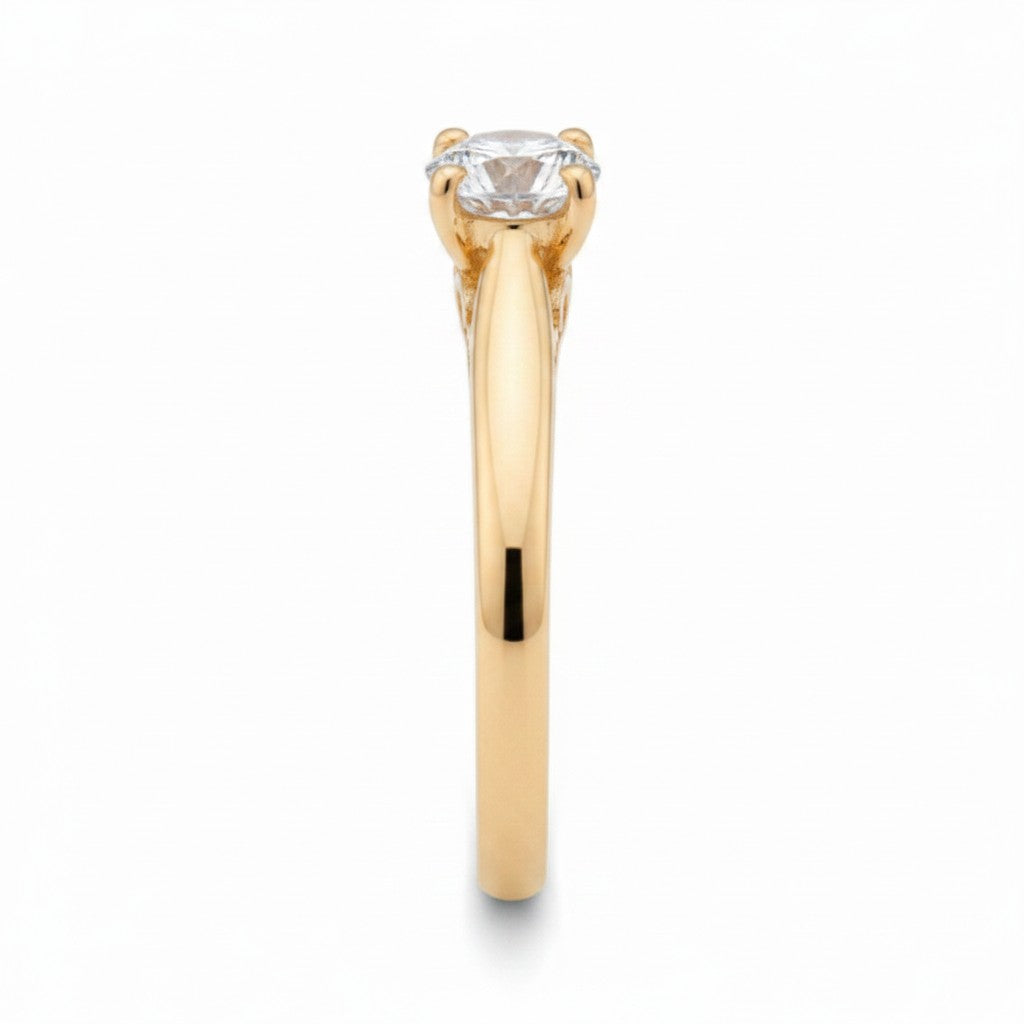 Jade18k Yesabel engagement ring in 18k orange gold with a round cubic zirconia stone and intricate detailing on the band.