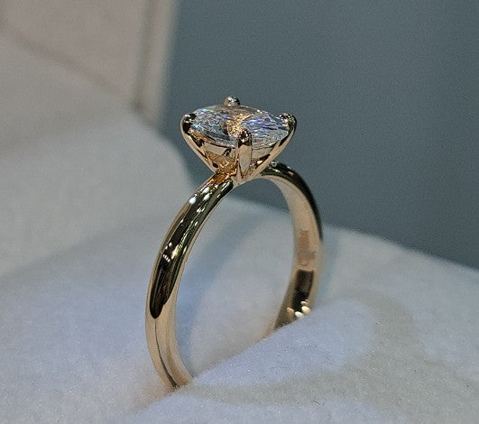 Jade18k engagement ring in 18k orange gold with a marquise-cut cubic zirconia stone.