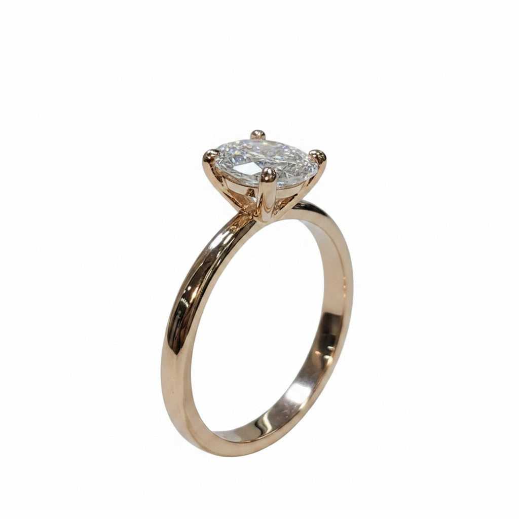Jade18k engagement ring in 18k orange gold with a marquise-cut cubic zirconia stone.