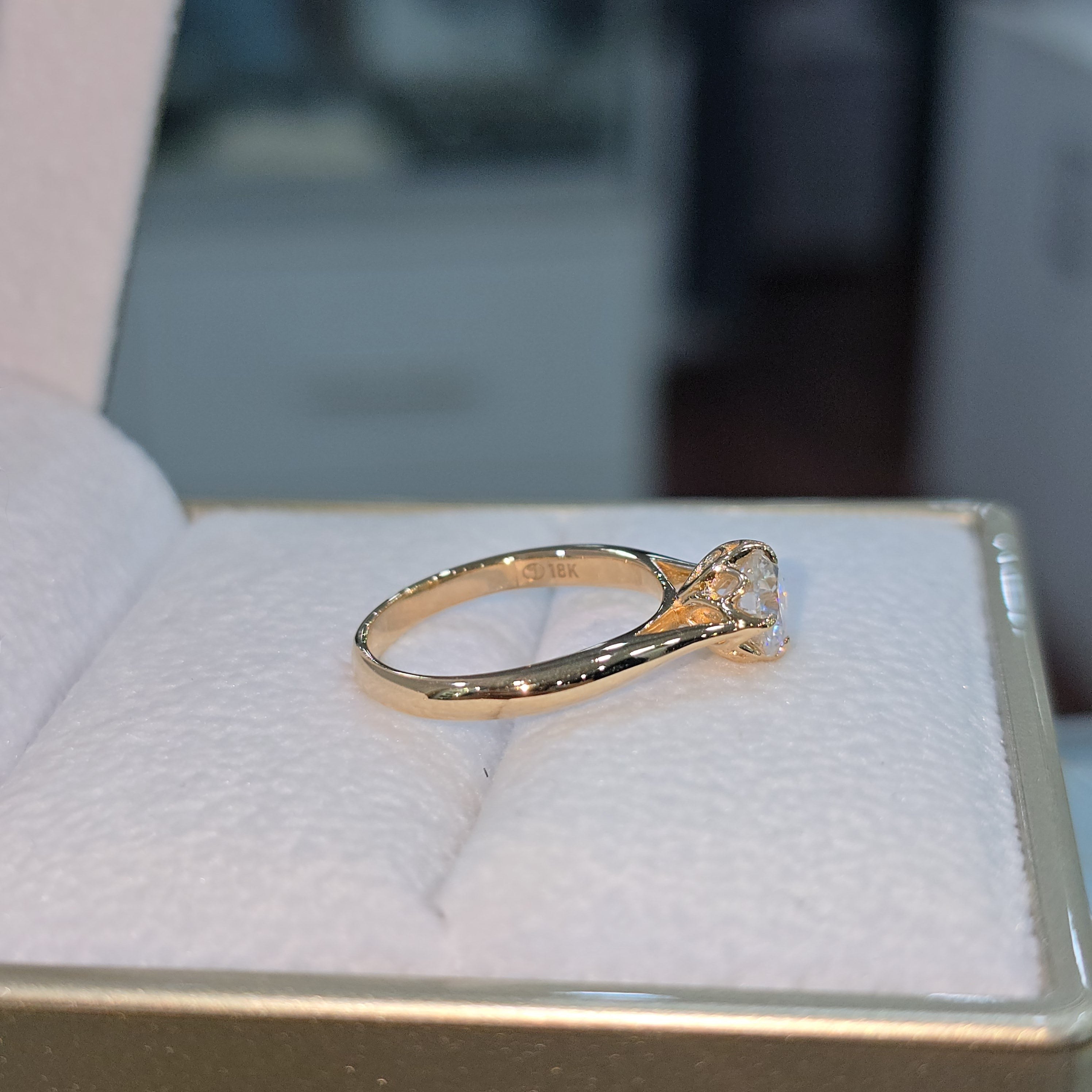 Jade18k orange gold 18k engagement ring with moissanite and love seal design.