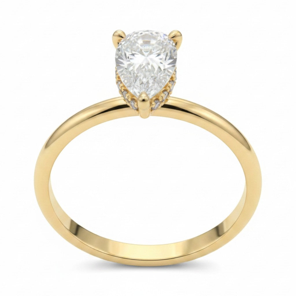 Jade18k 18k orange gold engagement ring with pear-cut zircon stone and small diamonds on band.