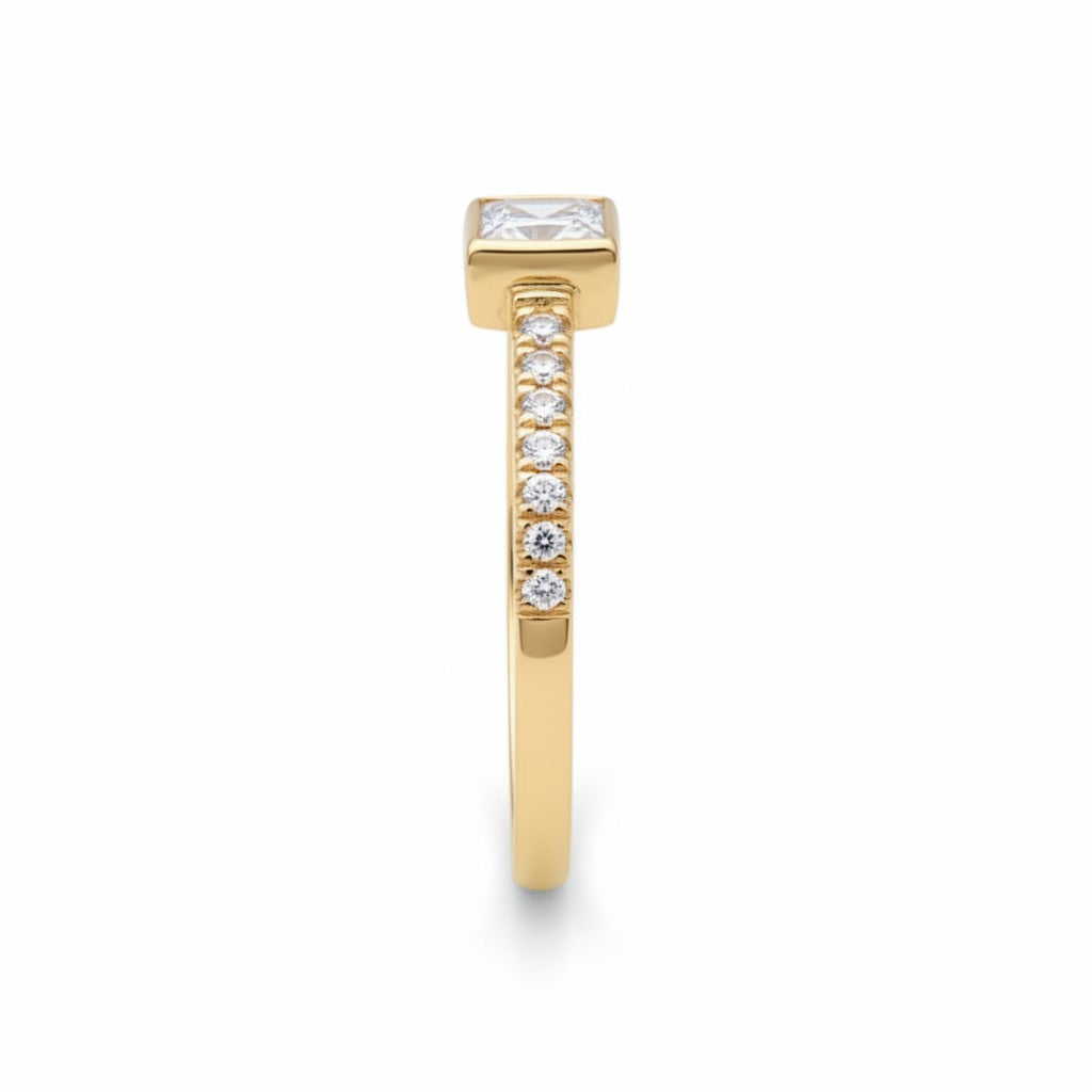 Jade18k Laura engagement ring in 18k orange gold with a princess-cut cubic zirconia and small stones on the band.