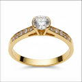 Jade18k Elemental engagement ring in 18k orange gold with a central zircon stone and small stones on the band.