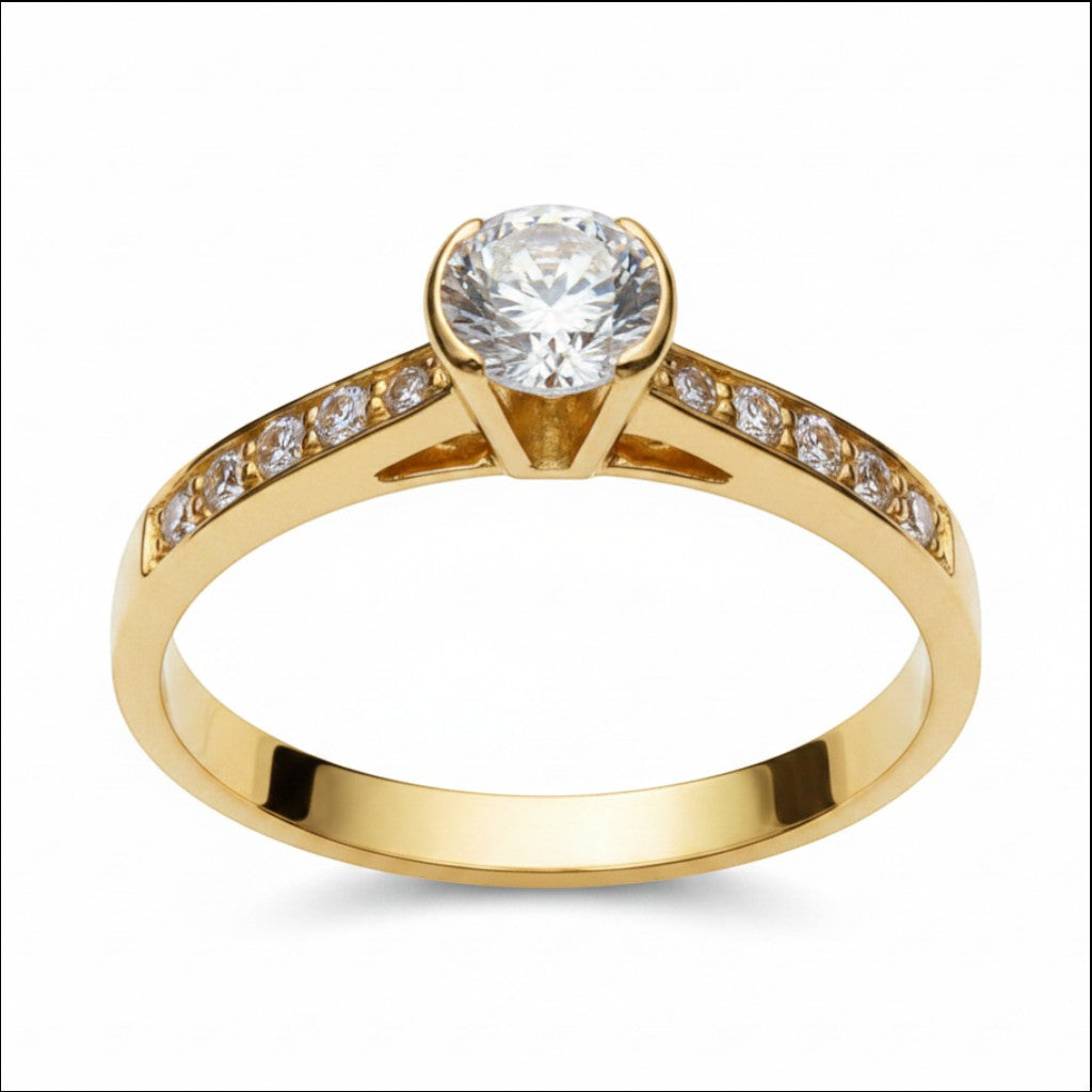 Jade18k Elemental engagement ring in 18k orange gold with a central zircon stone and small stones on the band.