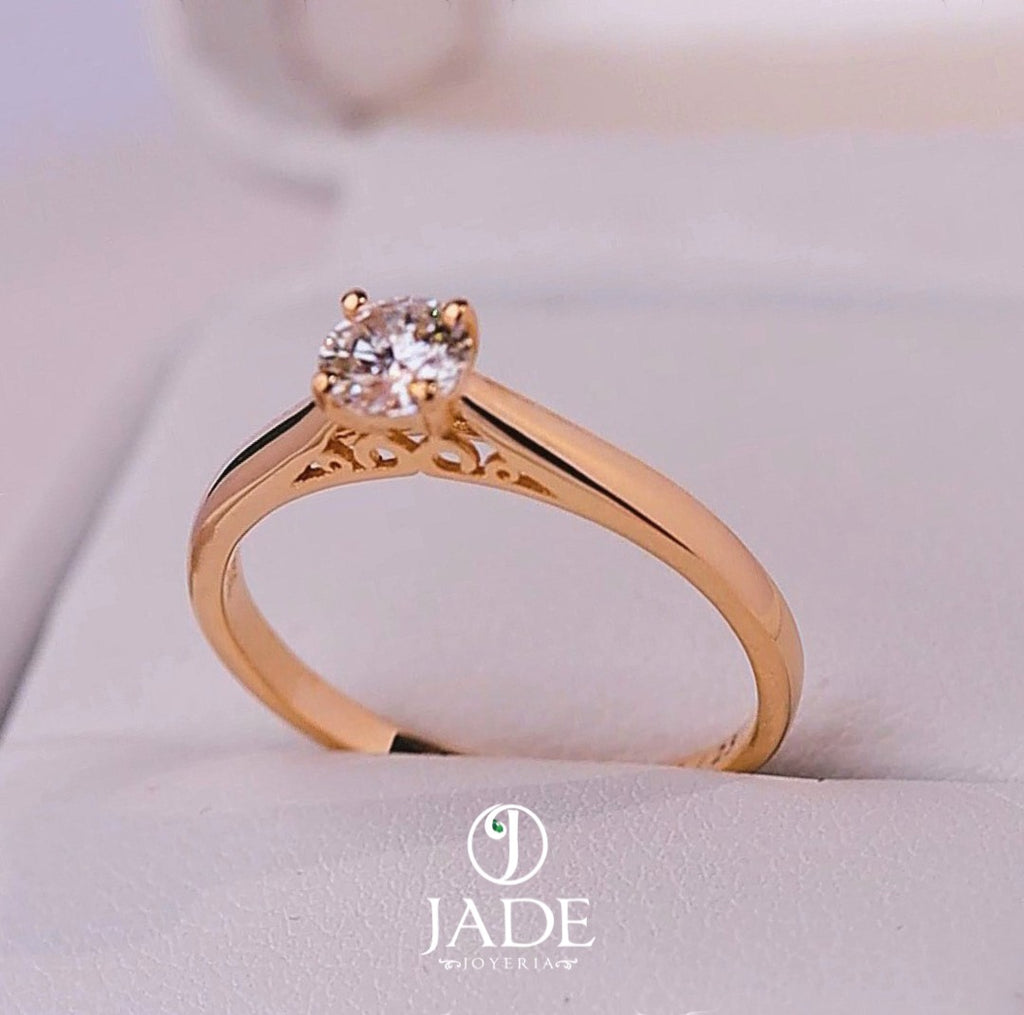 Jade18k Yesabel engagement ring in 18k orange gold with a zircon stone and intricate detailing on the band.