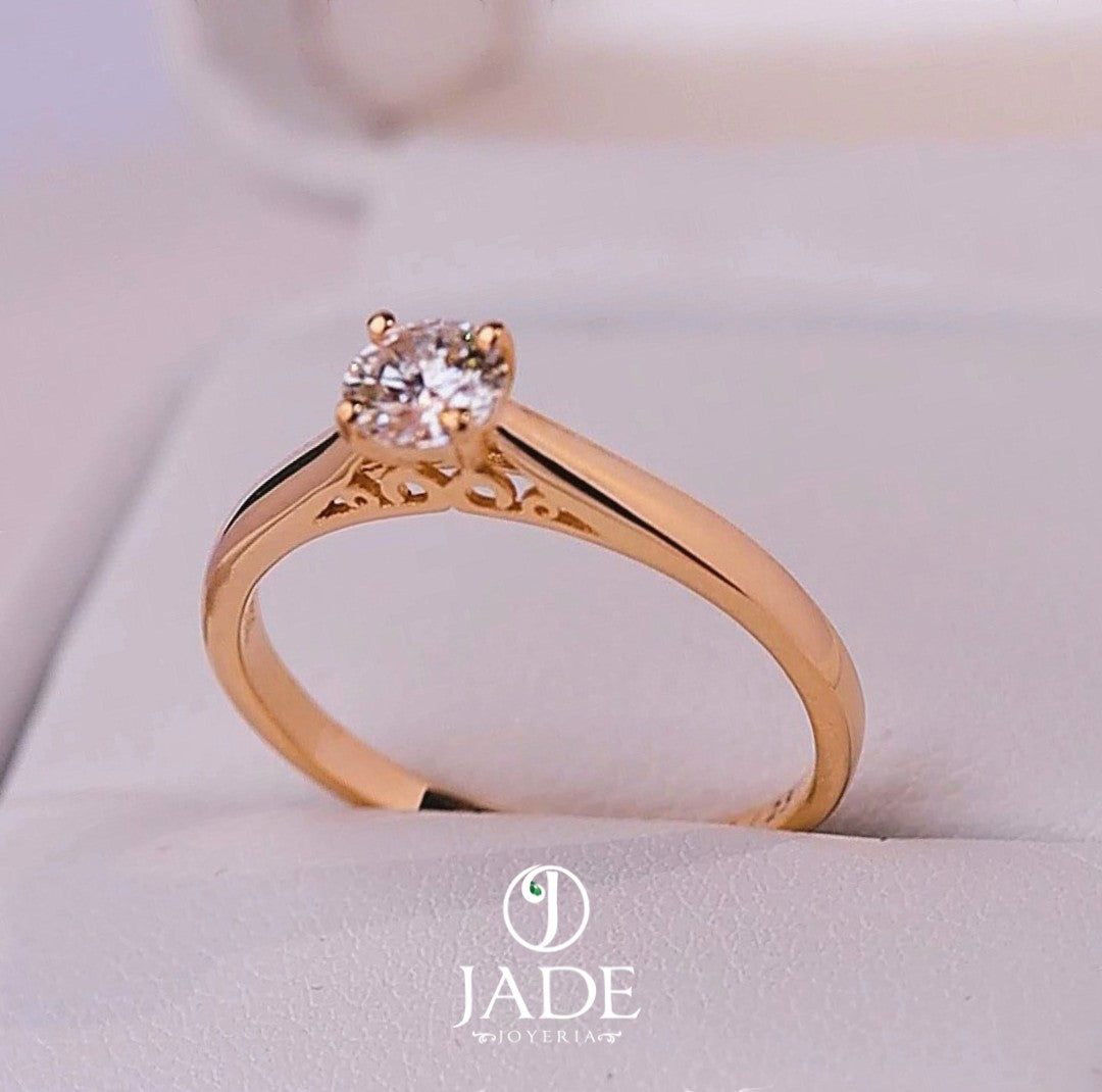 Jade18k Yesabel engagement ring in 18k orange gold with a zircon stone and intricate detailing on the band.