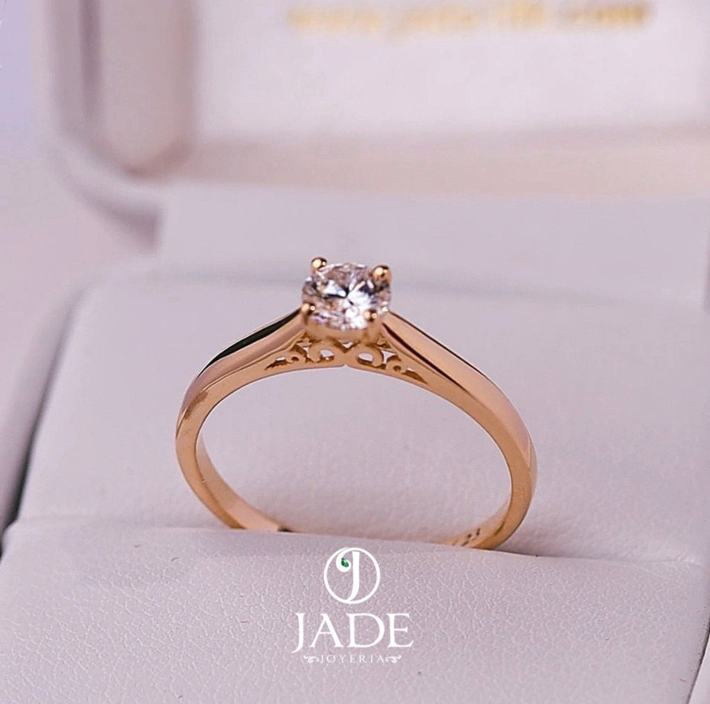 Jade18k Yesabel engagement ring in 18k orange gold with a zircon stone and intricate detailing on the band.