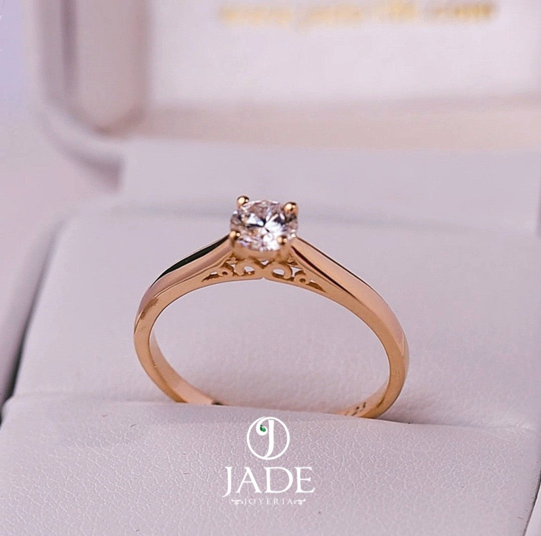 Jade18k Yesabel engagement ring in 18k orange gold with a zircon stone and intricate detailing on the band.