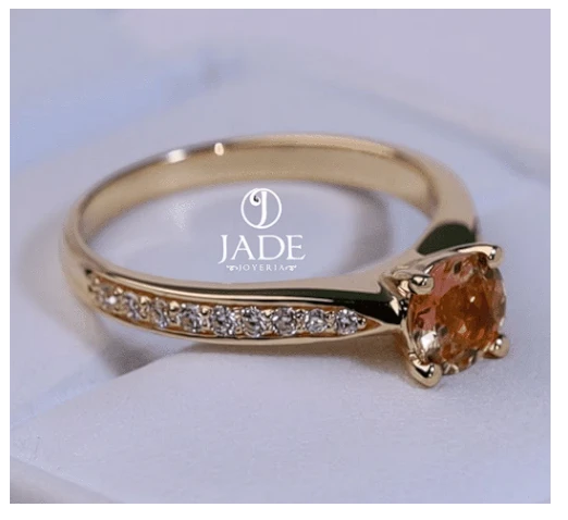 Jade18k Camille engagement ring in 18k orange gold with a 5A zircon stone and pave diamond band.