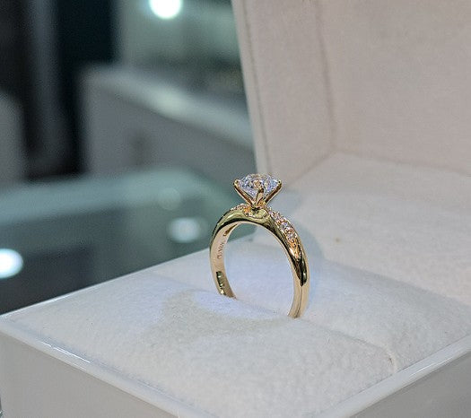 Jade18k 18k orange gold eternity engagement ring with pave set cubic zirconia stones.