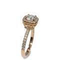 Jade18k 18k orange gold engagement ring with moissanite center stone and halo, pavé band.