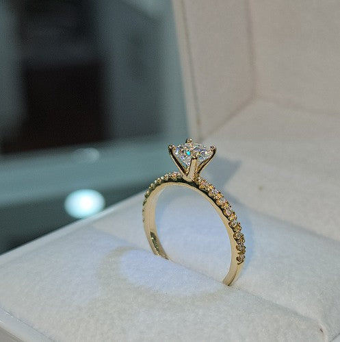 Jade18k Angella engagement ring in 18k orange gold with moissanite stones and pavé band.