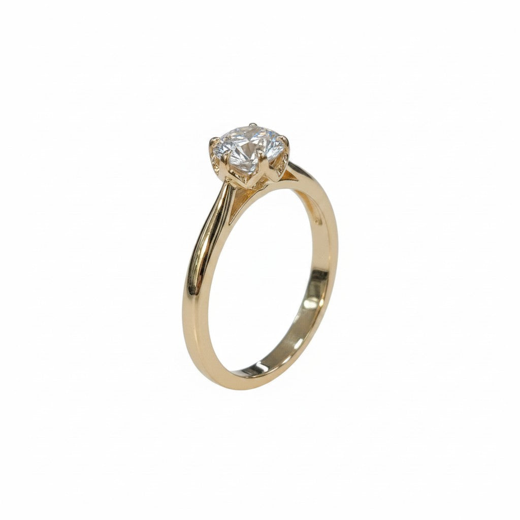Jade18k 18k orange gold engagement ring with a round moissanite center stone and a delicate band.