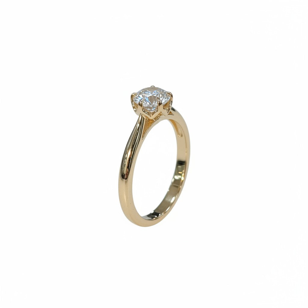 Jade18k 18k orange gold engagement ring with a moissanite center stone and a floral-inspired setting.