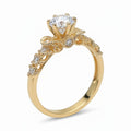 Jade18k 18K orange gold engagement ring with moissanite center stone and intricate band detailing.