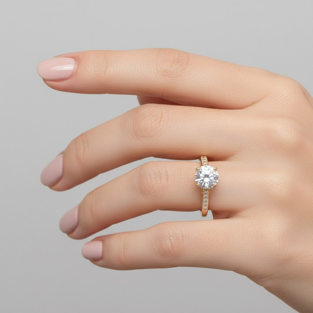 Jade18k 18k orange gold engagement ring with a large moissanite center stone and small accent stones on the band.