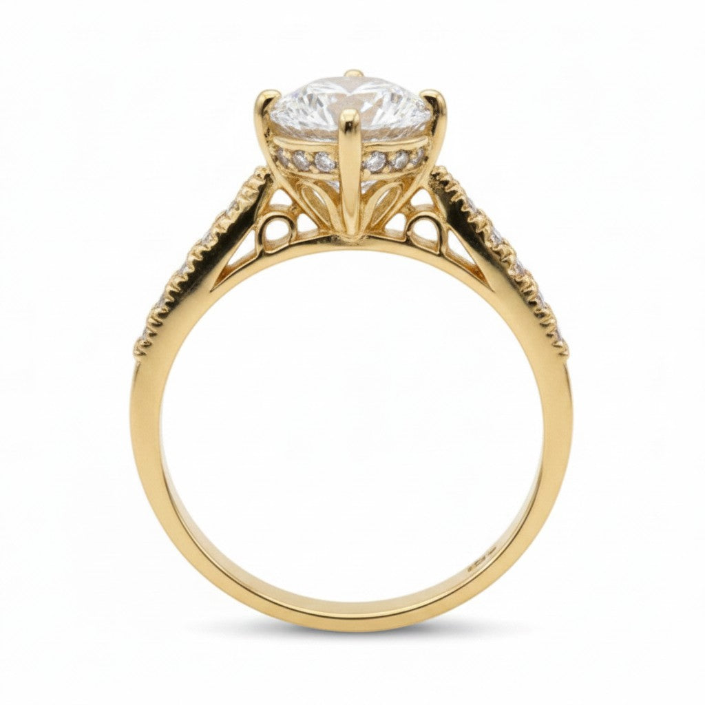 Jade18k 18k orange gold engagement ring with a large moissanite center stone and small accent stones on the band.