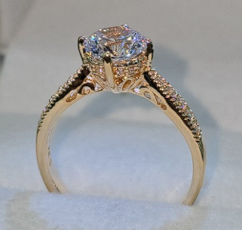 Jade18k 18k orange gold solitaire ring with cubic zirconia stones and intricate detailing on the band.
