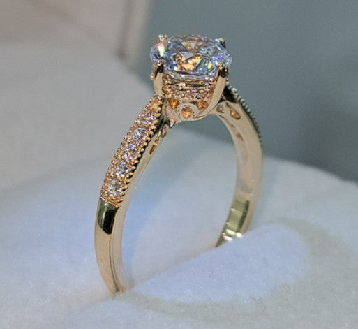Jade18k 18k orange gold solitaire ring with cubic zirconia stones and pavé detailing on the band.
