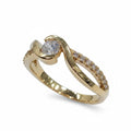 Jade18k orange gold ring with a central zircon stone and small pave zircon accents. Approx. 5g.