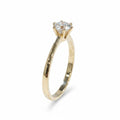 Jade18k Destello Infinito ring in 18k orange gold with a round-cut zircon stone.