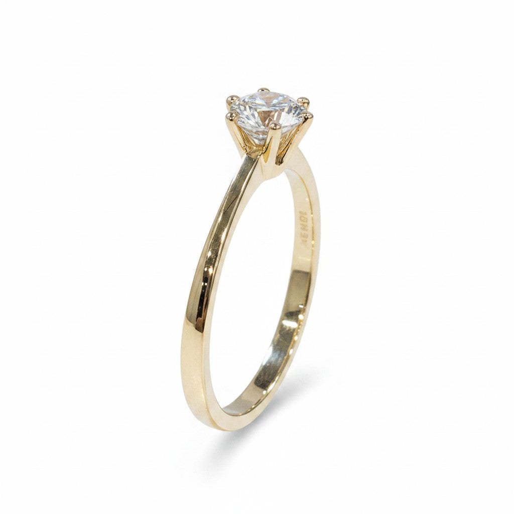 Jade18k Destello Infinito ring in 18k orange gold with a round-cut zircon stone.