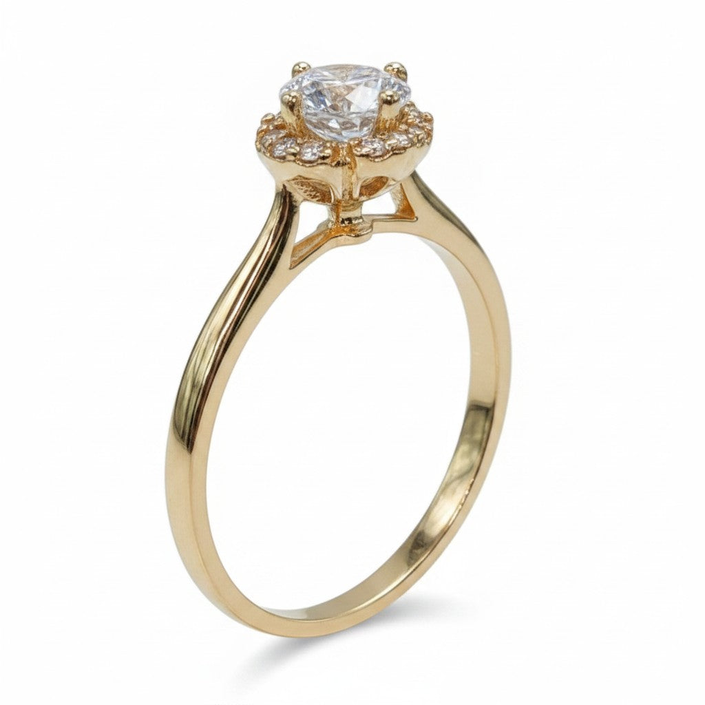 Jade18k La Llama de Gala 18k orange gold ring with a central zircon stone surrounded by smaller zircons.